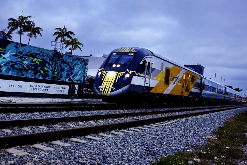 A Brightline train passes through the Miami Design District on its way to Brightline Miami Station in Miami, Florida, US, on Tuesday, February 6, 2024. (Eva Marie Uzcategui / Los Angeles Times)