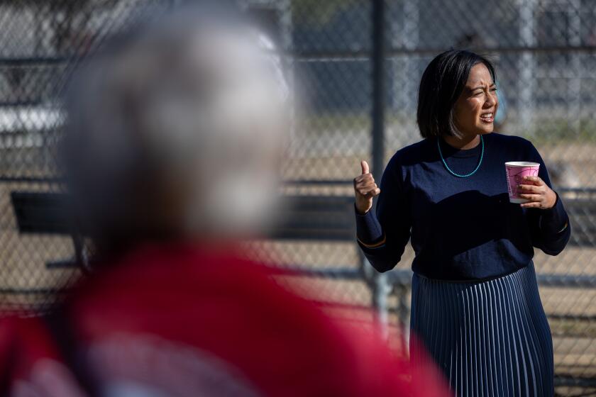 Los Angeles, CA - January 07: Attorney Ysabel Jurado, who is one of the seven challengers seeking to unseat City Councilmember Kevin de Leon in the March 5 election, talks with volunteers before heading out to canvass voters on Sunday, Jan. 7, 2024 in Los Angeles, CA. (Brian van der Brug / Los Angeles Times)